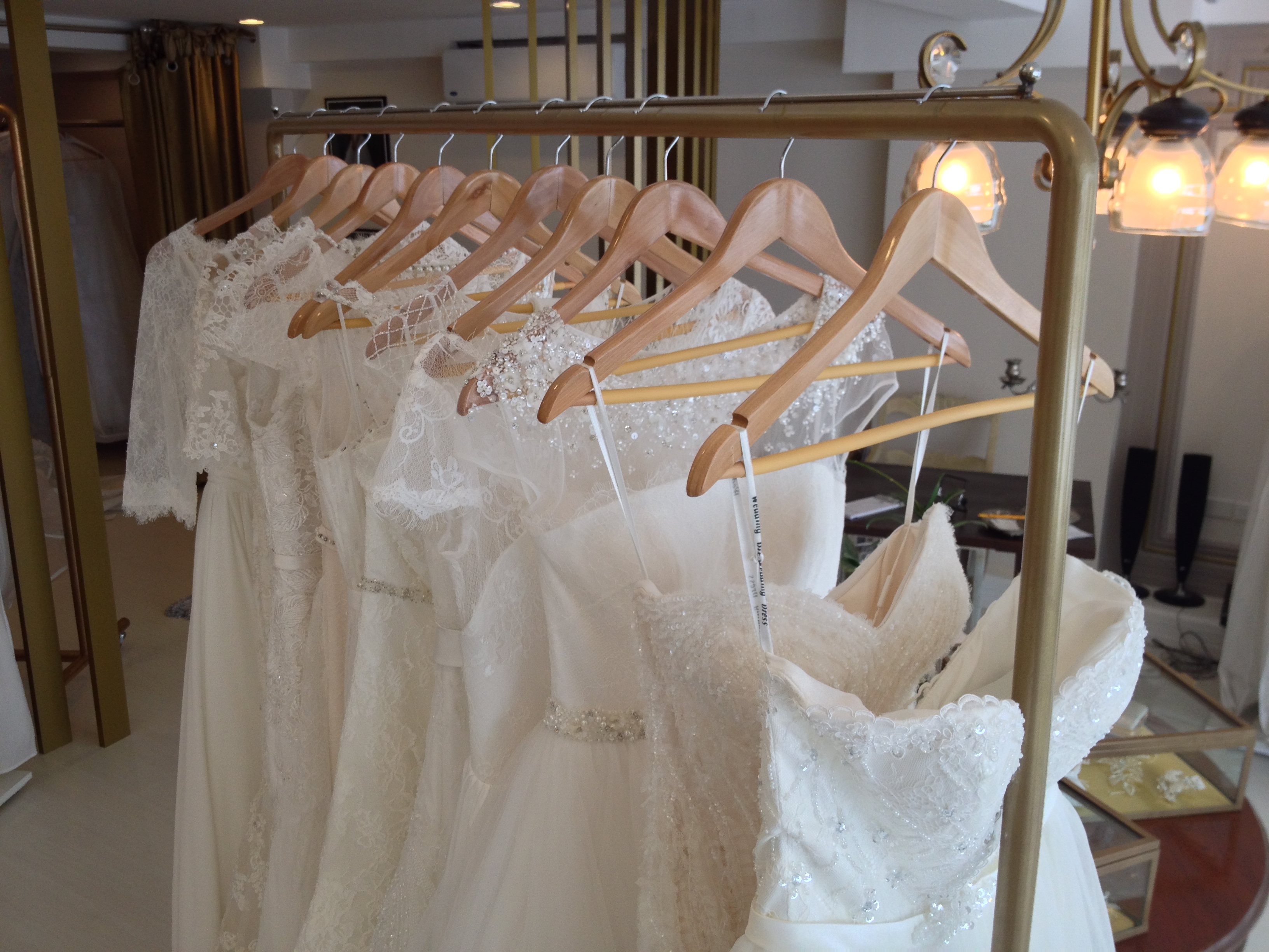 A rack of bridal gowns available for rent at The Bridal Room. 