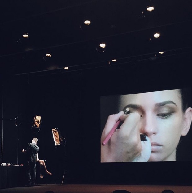 Mario applies eyeliner on his model