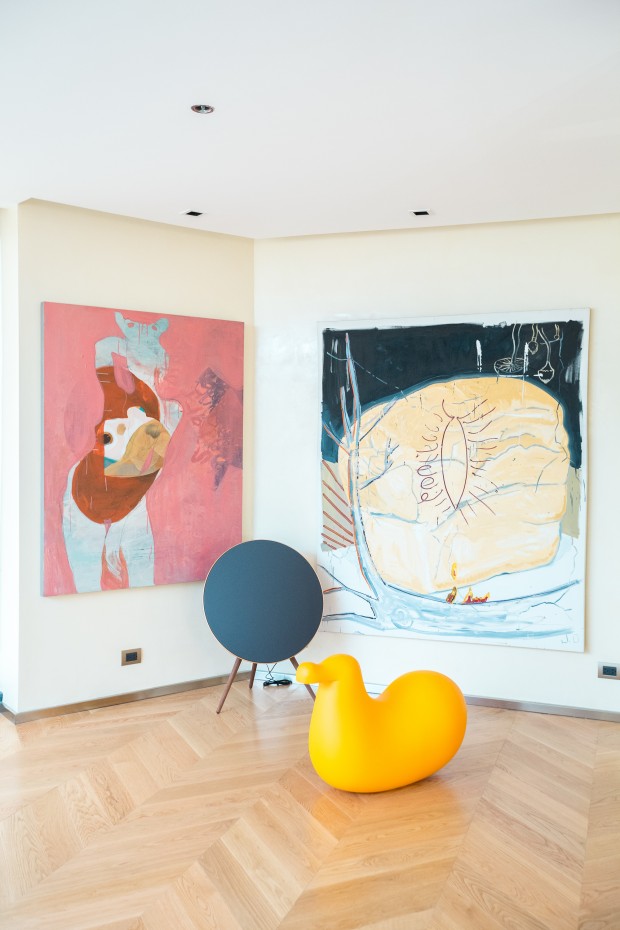 Paintings by Chati Coronel and Nikki Ocean are a few of the pieces displayed in the living room.