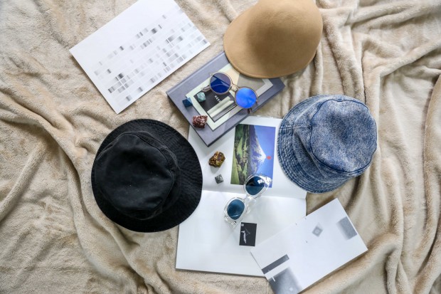 “I’m not much of an accessories girl, but I do love hats!” Black fisherman hat from Uniqlo, denim bucket hat from Uniqlo, camel equestrienne hat from a thrift shop, grey sunglasses from Retina, and clear sunglasses from Uniqlo