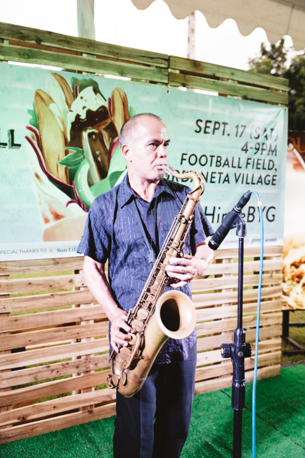 vince lahora performing with saxophone